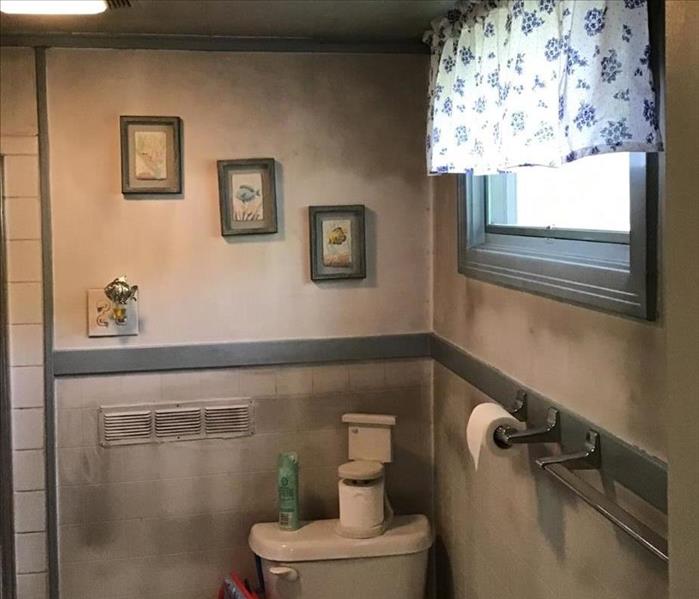 A photo of smoke damage in a bathroom caused by a space heater,